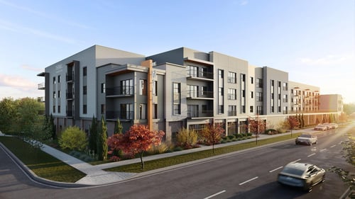 apartment building at the corner of 2 streets with multicolored trees and bushes planted in front of the building