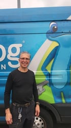Plumber David de Anda in front of a bluefrog Plumbing van