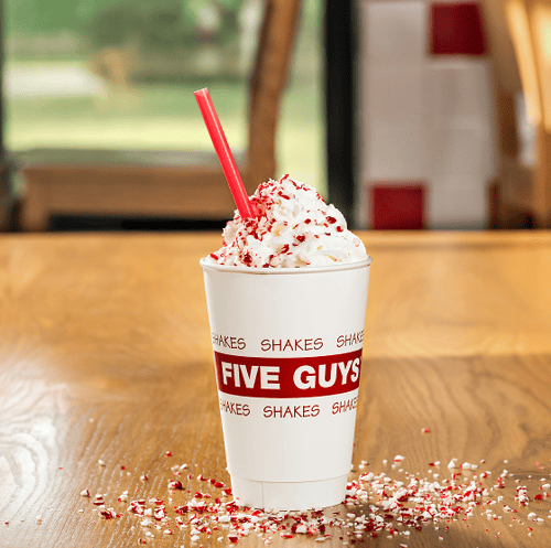 Five Guys milkshake with whipped cream.