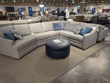 Amery Slumberland Furniture white sectional with matching accent pillows