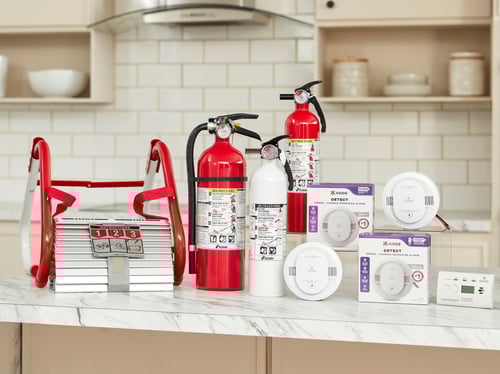 A group of Kidde products on a kitchen counter.