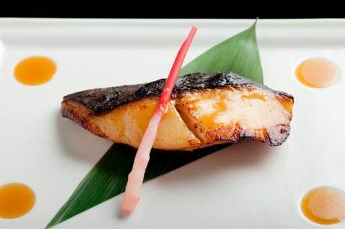 the signature black cod fillet marinated and roasted in a sweet miso sauce