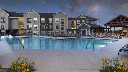Resort-style pool at night at Watermark at Harvest Junction, Longmont, CO