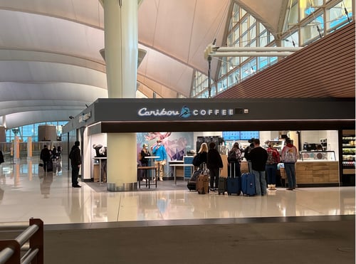 Storefront of the Caribou Coffee at 8500 Pena Blvd in Denver