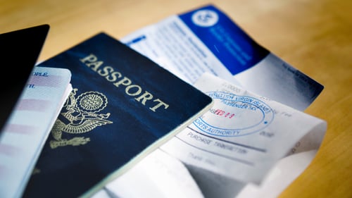 Passports and passport documents on table