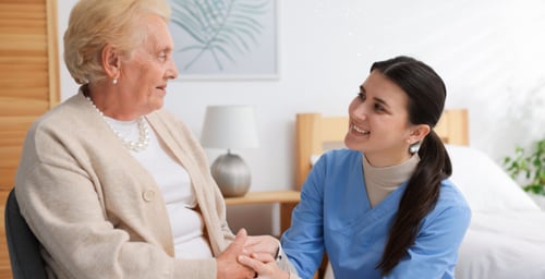 home nurse embracing an older client