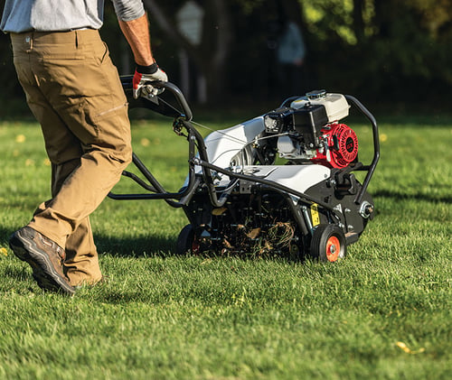 Operator uses a Bobcat ae19 Aerator to quickly aerate a lawn