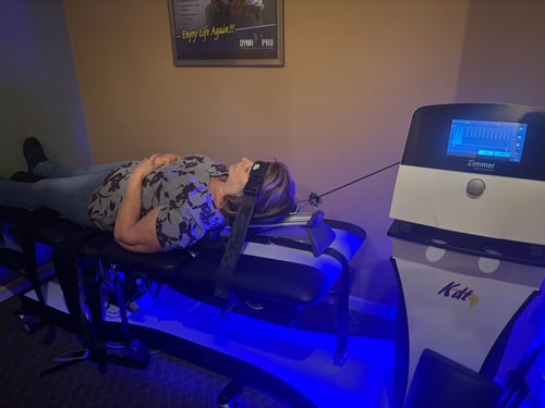 Patient receiving spinal decompression therapy using an advanced KDT machine.