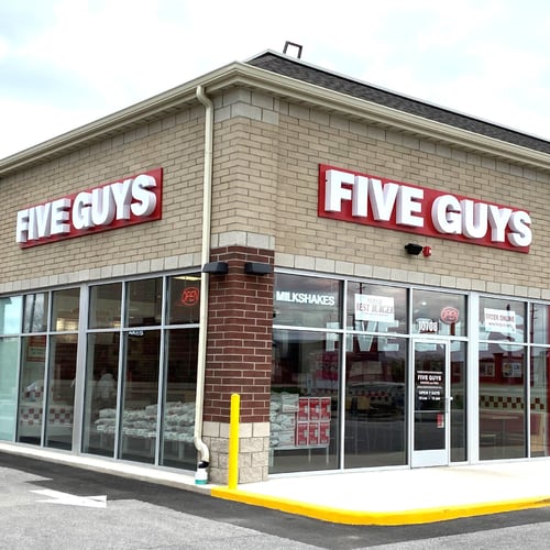 Exterior photograph of the Five Guys restaurant at 10708 Broadway Street in Crown Point Indiana.
