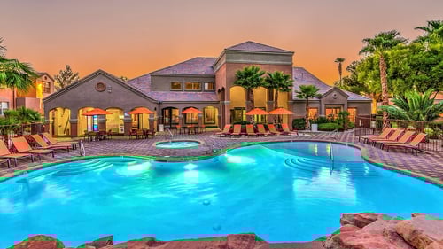 A large house with a pool in the backyard at Copper Creek Apartments, Las Vegas, NV, 89123
