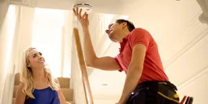 couple-installing-alarm