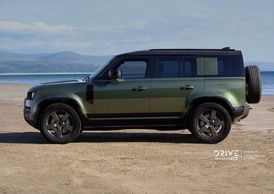 Green Defender Vehicle next to the sea