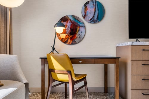 Need to work? Enjoy a desk, lamp, and chair in your room.