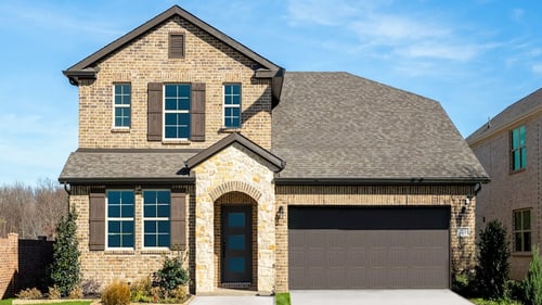 two-story brick home exterior with garage