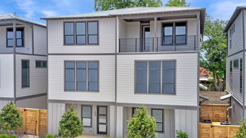 new duplexes with gray siding exterior