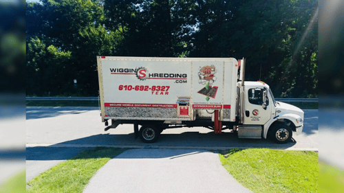 A Wiggins Shredding mobile shred truck parked on a residential street