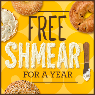 Bagels and cream cheese with text saying Free Shmear For a Year in the middle next to a butter knife