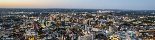 Birmingham Buy-to-Let Property Investment - STOCK Birmingham, United Kingdom Aerial view over the city centre by night, rail station