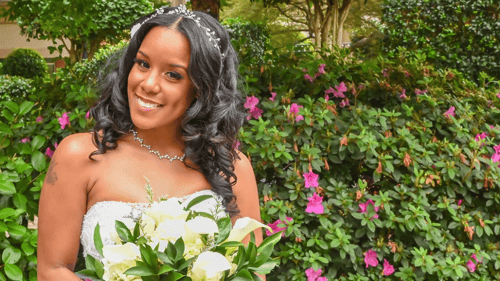photo of a bride holding floral bouquet