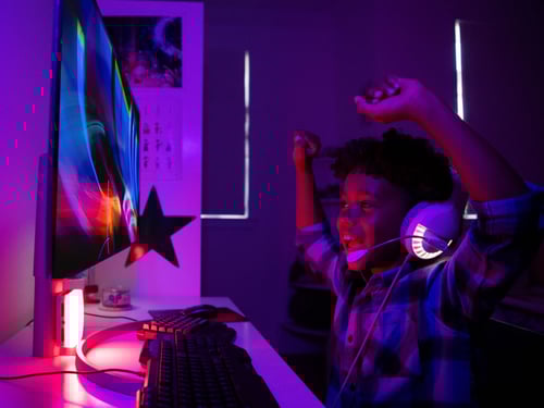 Teen boy gaming at home in Howey In The Hills, FL