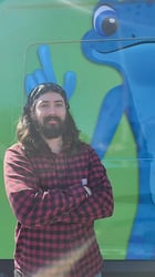 Plumber Shae Petterson in front of a bluefrog Plumbing van