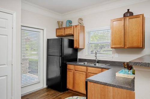 Gourmet Kitchens with G.E. Black Appliances and Maple Raised-Panel Cabinetry at Legends at Villas at Carrington Square Apartments, Overland Park, KS 66221