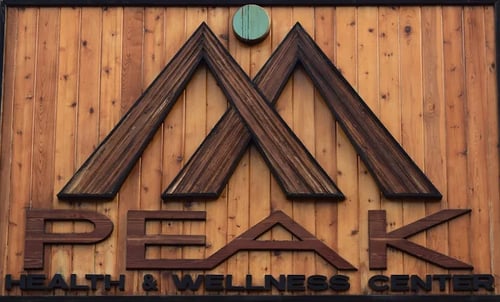 Peak Health and Wellness Center logo on the exterior of the building