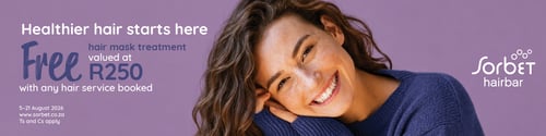 Sorbet Hairbar promotional advert featuring a smiling woman with long, wavy brown hair wearing a purple knit sweater against a soft lavender background.