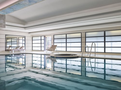 Day time view of the pool at Club 10 with natural light reflects on the water