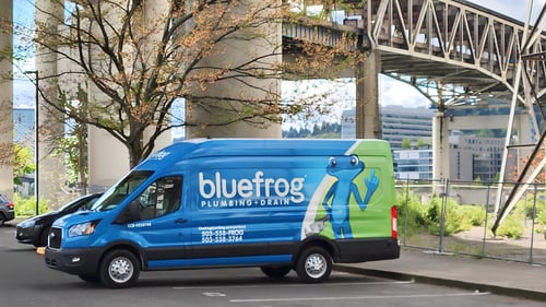 a bluefrog Van parked in Southeast Portland with the Marquam Bridge in the background
