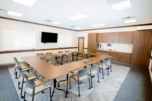 Meeting room with tables and chairs for a variety of seating options.