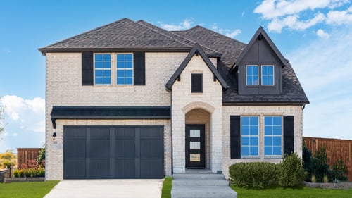 two-story home with white brick exterior & covered front door