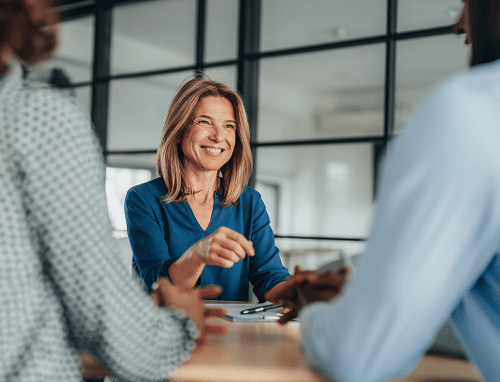 Female business woman meeting with two clients.