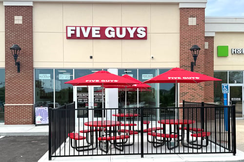 Exterior photograph of the Five Guys restaurant at 143 Franklin Street in Westerly, Rhode Island.
