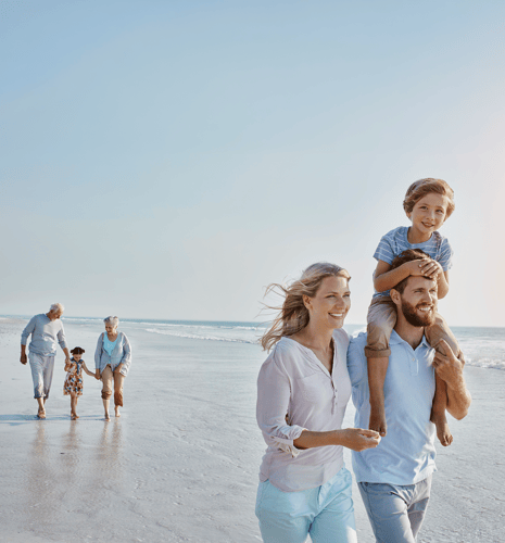 Multigenerational family on beach.