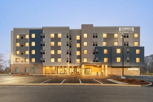 Norfolk hotel exterior with illuminated facade and main entrance.