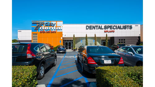 Exterior of the 7 Day Dental Lincoln Ave office and Dental Specialists entrance in Anaheim with storefront signage