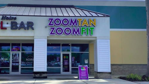 Zoom Tan & Zoom Fit storefront in Freedom Square Plaza (Naples, FL)