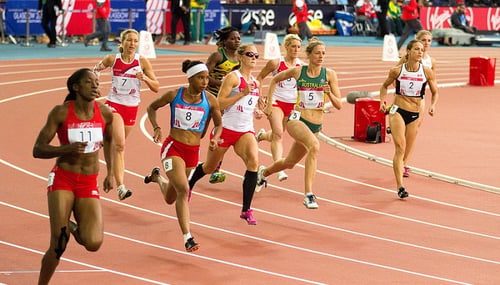 Image of women running on a track.