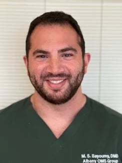 Dr. Bayoumy Smiling In Office