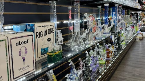 Various glass pipes on a long shelf