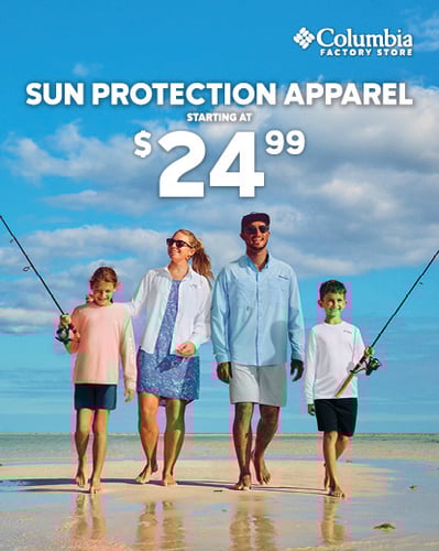 Family walking on beach.