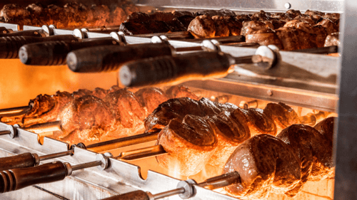 All of our meats are cooked the gaucho way - over an open flame with natural wood charcoal.