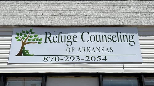 Refuge Counseling of Arkansas sign with logo and phone number