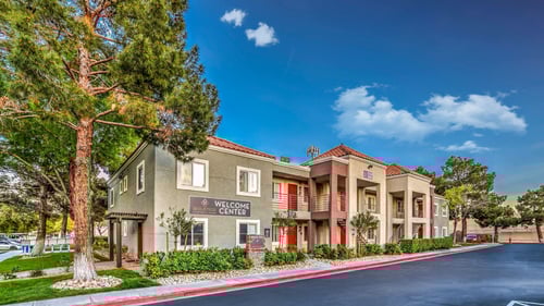A building with a sign that says Welcome Center at Solstice Apartment Homes, Las Vegas, NV, 89108