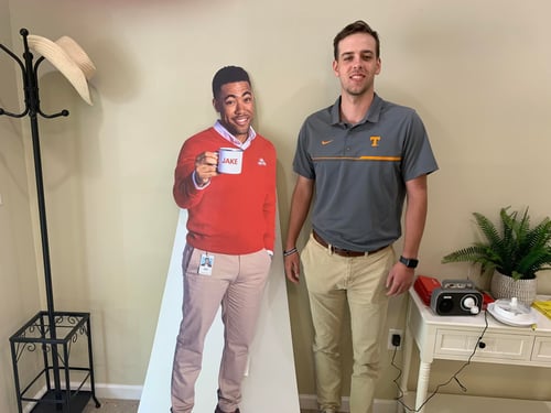 Team member standing in office with Jake from State Farm