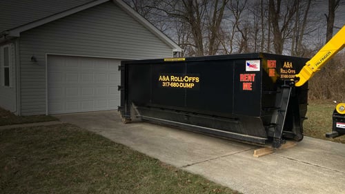 dumpster in driveway
