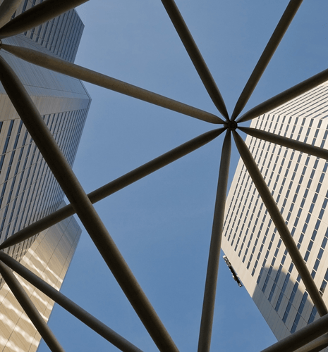 Bottom-up view of high-rise buildings.
