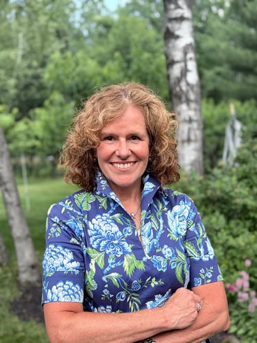 Portrait of Dr. Munn smiling outdoors in professional attire
