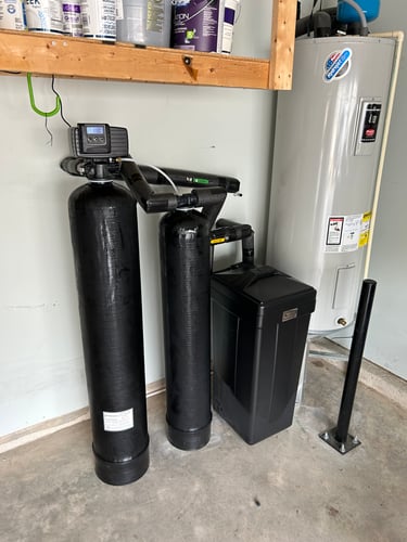 water filtration pump inside a home under a wooden beam
